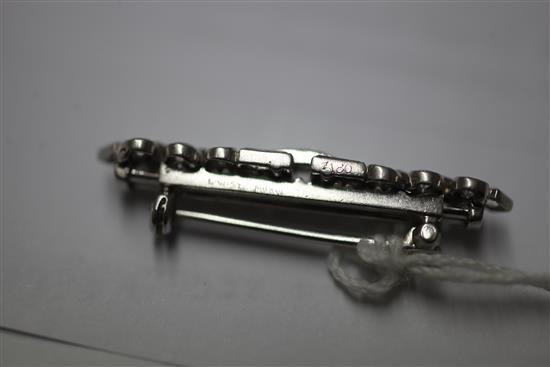 A mid 20th century Cartier platinum and diamond bar brooch, 36mm.